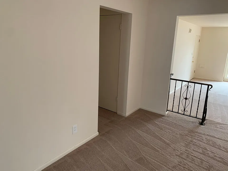 Looking left from the first picture to the hallway with bedrooms