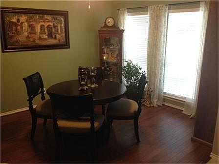 DINING ROOM WITH LAMINATE WOOD FLOORS