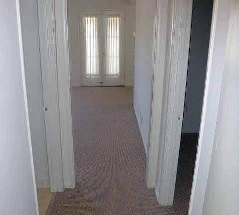 Bathrm dr. to the left, bdrm doorway to the right. At the ba