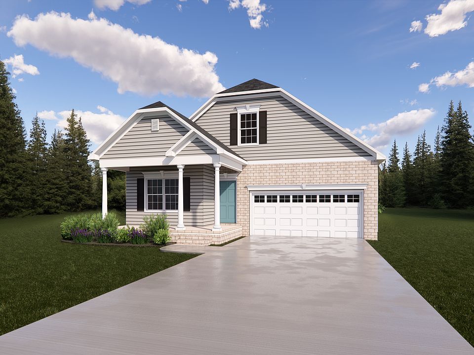 A modern suburban house in the serene Haley Meadows, featuring a driveway, garage, and surrounding t