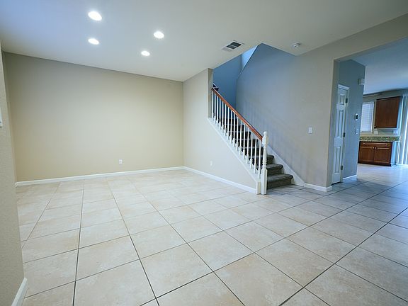 formal dining area and stairs to 2nd floor