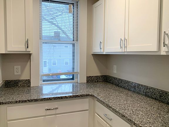 Butler Pantry with Plenty of Cabinetry for Extra Storage & Granite Counters.