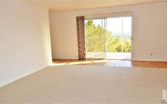 Living room looking onto deck and southern mountain view