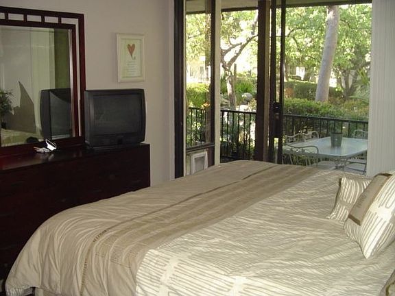 Master bed has entry to patio