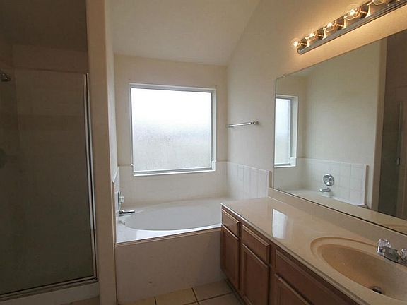 master bathroom has tub & sep.shower.