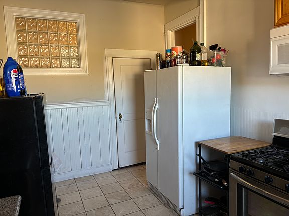 Kitchen with Gas Stove, Dishwasher, Microwave and large Refrigerator