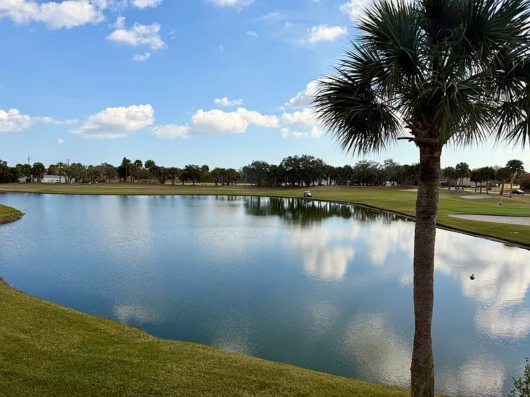 Enjoy STUNNING lake & golf course views from the Living Room & Primary Bedroom!