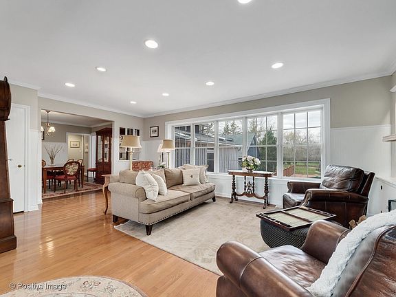 Views capture the pool and the rear yard