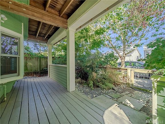 The covered front porch has room for some seating or just to be out of the weather