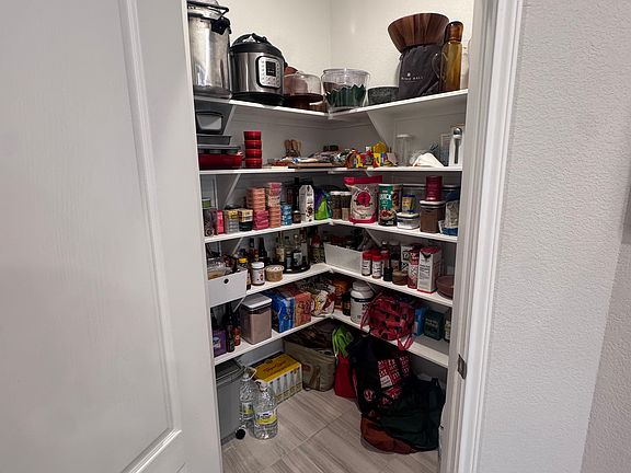 Walk in pantry with plenty of storage for snacks!