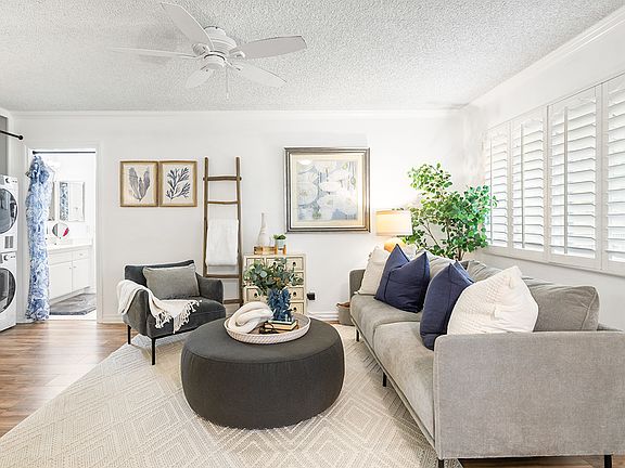 Living area with stylish plantation shutters for privacy.
