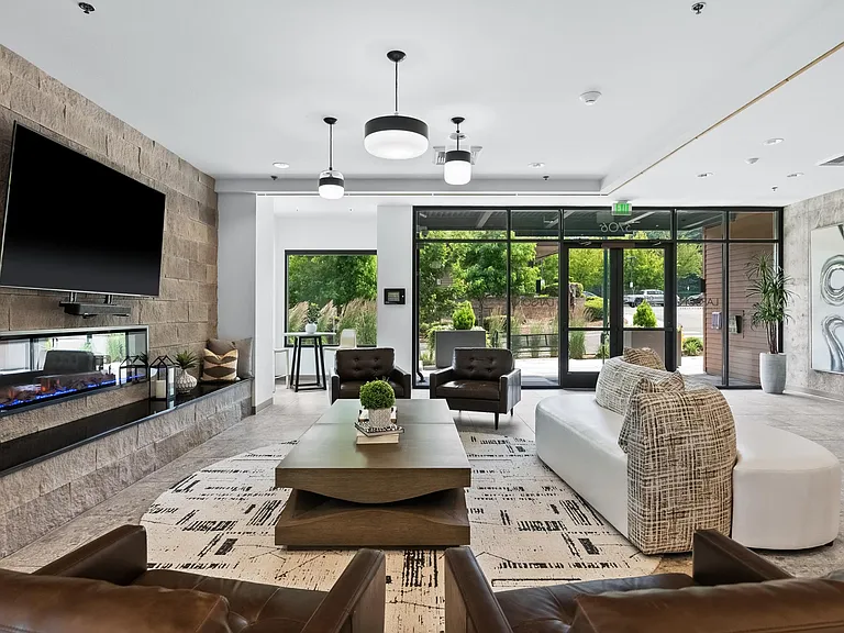 Kick back in the TV lounge, designed for comfort and relaxation with a welcoming fireplace setting and the perfect space to stream, watch, or unwind.