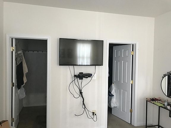 Bedroom with bathroom and walk in closet