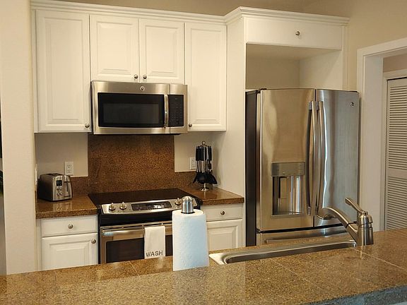 Kitchen with granite surrounds and beautiful energy efficient appliances.