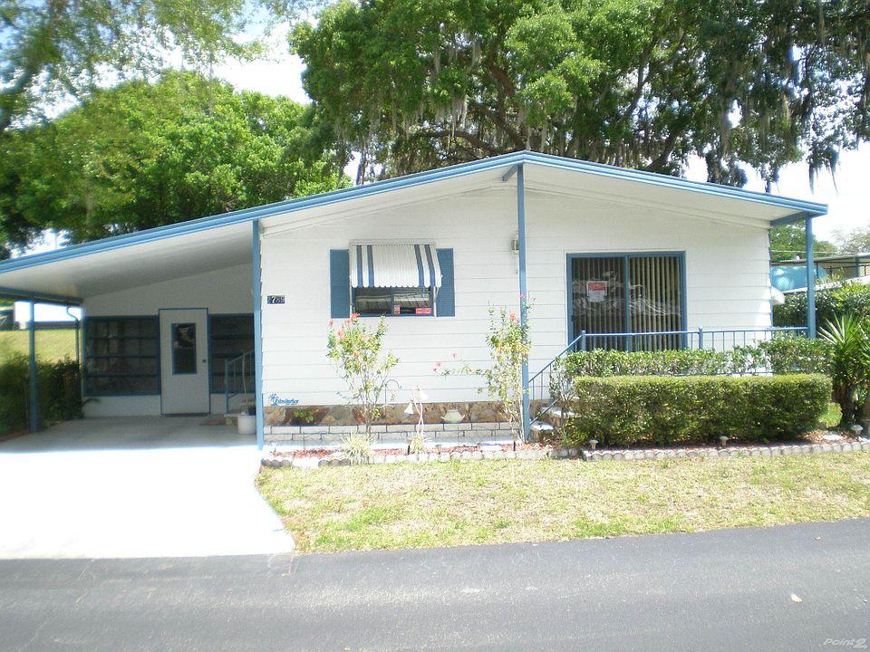 Front of Home with Attached Carport
