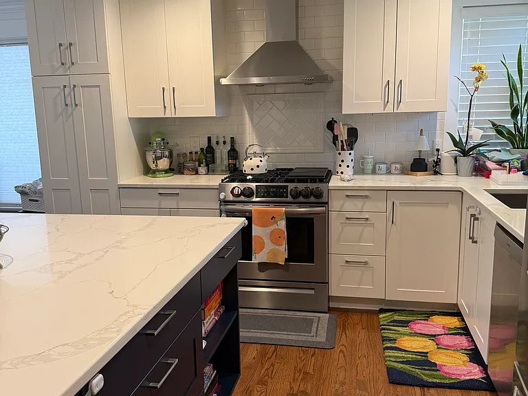 Open Kitchen with new appliances ad large island with bar seating.
