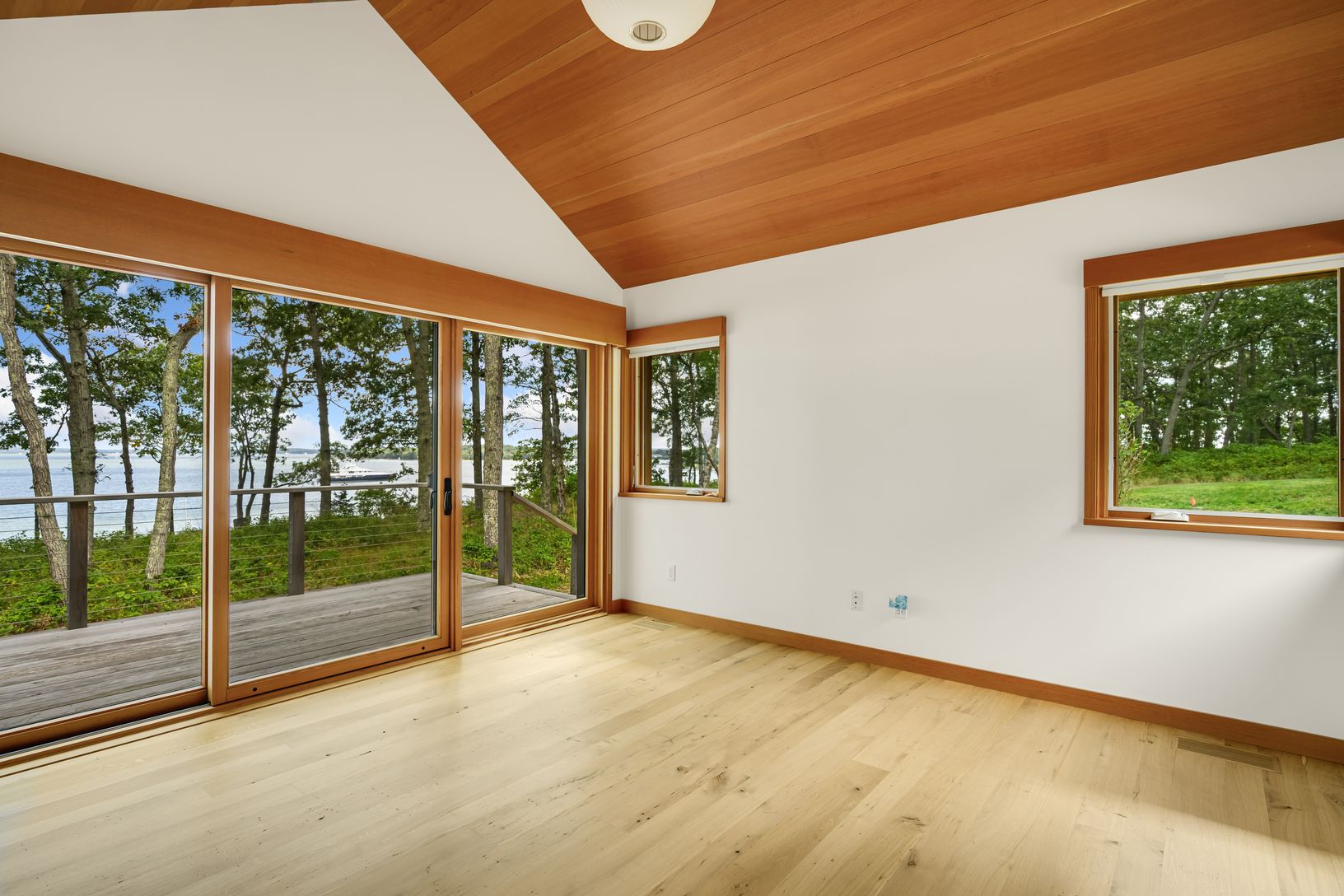 Primary bedroom second view with sliding doors to deck