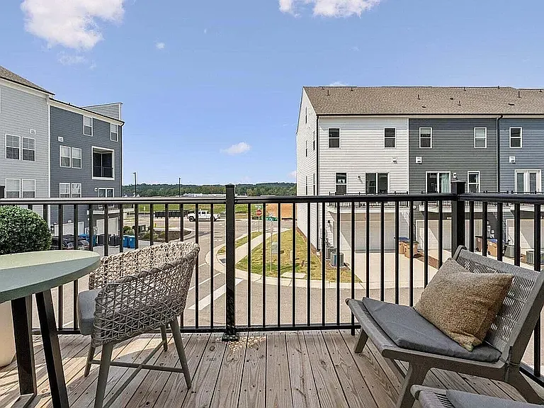 Enjoy peaceful views from your private deck overlooking the natural tree line and Grove 98 community. A unique blend of privacy, green space, and the convenience of a vibrant mixed-use community just steps away.