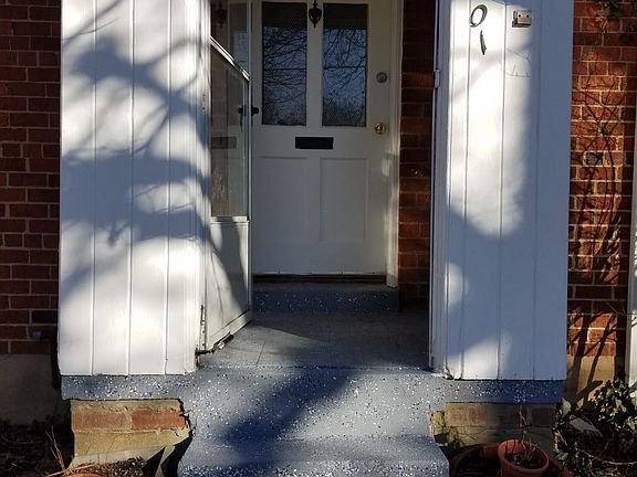 Front door inside front porch with door open.