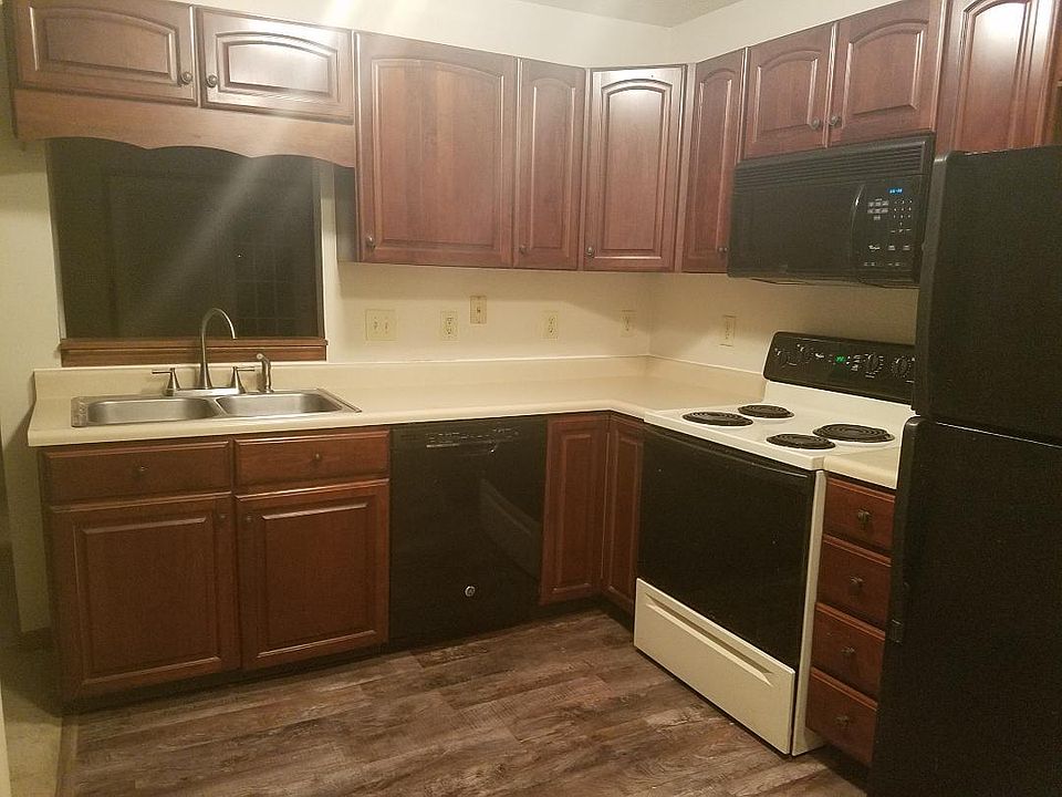 Cherry kitchen cabinets, appliances, new flooring, open floor plan, pantry, open to the great room and dining room.