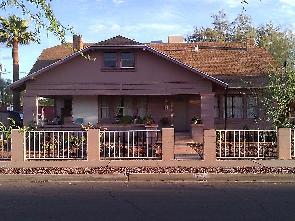 Large Bungalow Porch. House has been repainted cream with green trim.