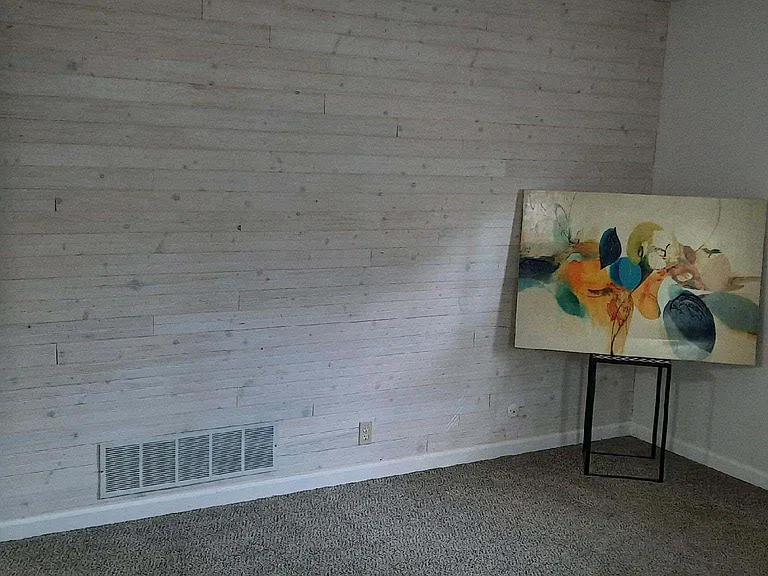 ...a bead board feature wall adds character to the living room space...