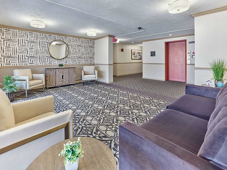Newly updated lobby at Audubon Arms Apartments featuring modern seating and designer finishes