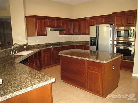 Kitchen with Center Island and SS Appliances
