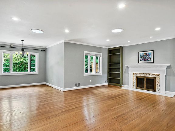 Large windows and skylights allow natural light into the family room and dining area.