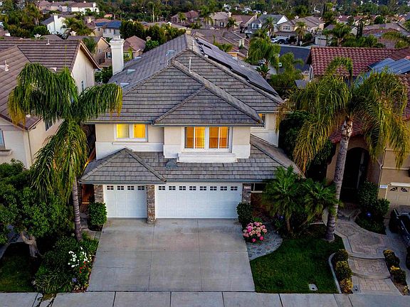 Check out a video on YouTube under 27759 Homestead. Front aerial elevation. Views from kitchen, kitchen nook, and family room. Lush landscaping, grass area, rose garden, vegetable garden.