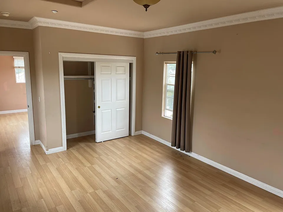 bedroom has closet, and windows on both sides. Plenty of sunlight