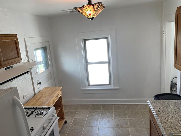 Kitchen eating area - can accommodate a small table with chairs. Plenty of light.