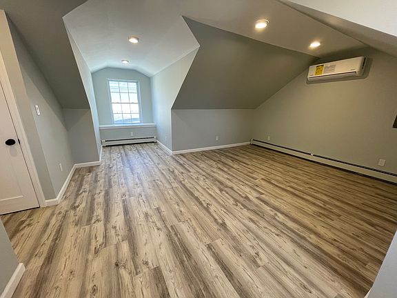 Extra large bedroom with vaulted ceilings, oversized windows that fill the space with natural light, and a large closet spacious, airy, and perfect for relaxing!