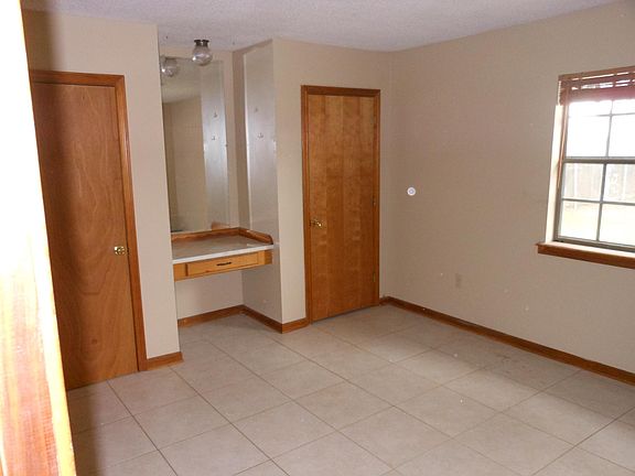 Master bedroom with full bath, two closets and vanity.