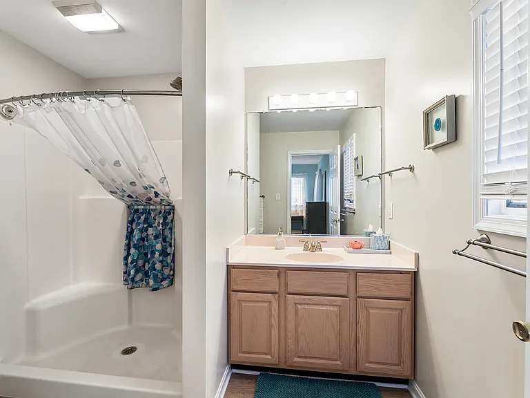 Convenient primary ensuite bathroom with space for comfortable daily routines during longer stays.