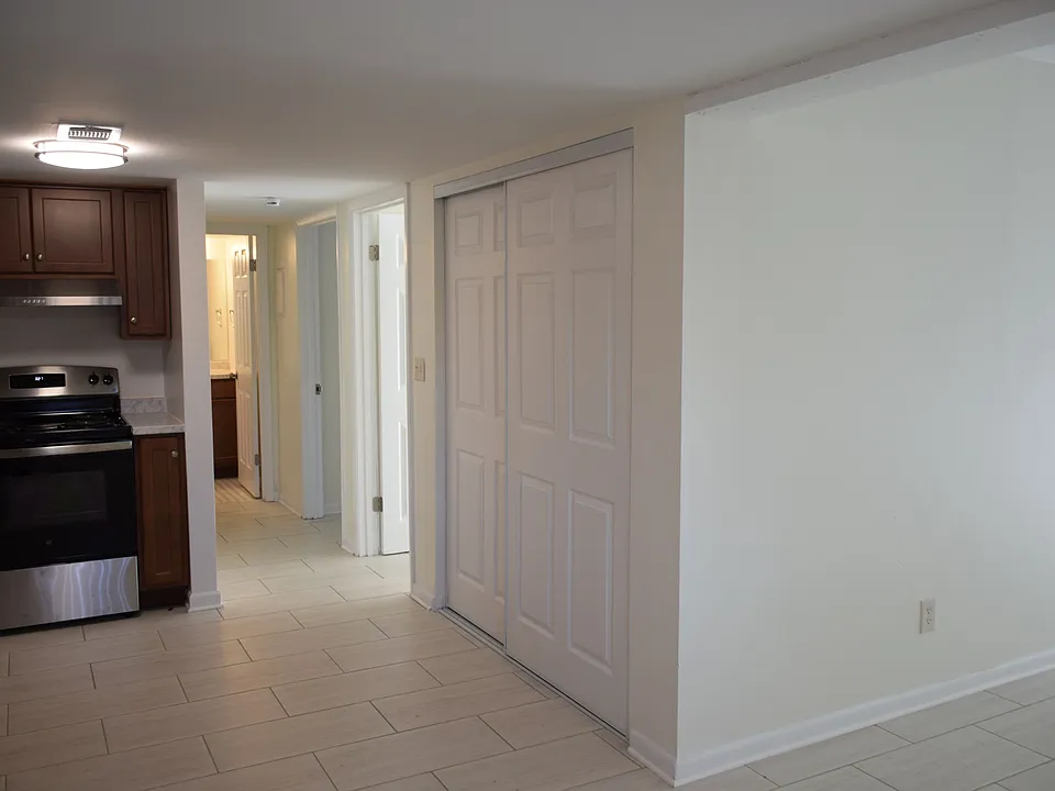 Dining Area to Hallway - to access bathroom (at end) and bedrooms.