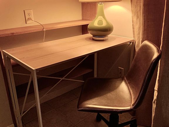 We've recently added a small dedicated work space. While the shelves are built/in, the desk easily folds and can be stored out of site along with the desk chair