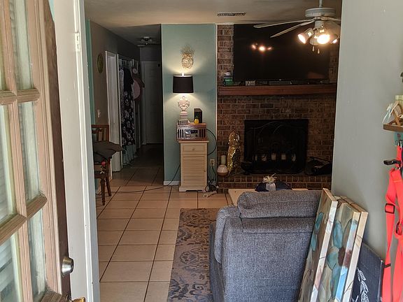 Entryway into open living room and dining room space