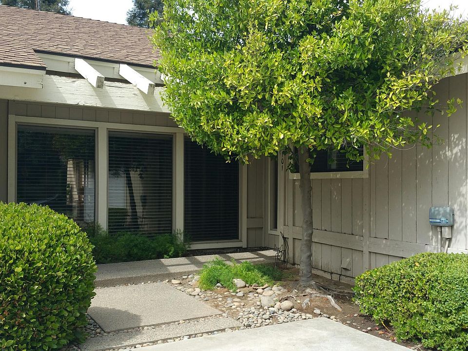 Large windows in living room provide natural lighting