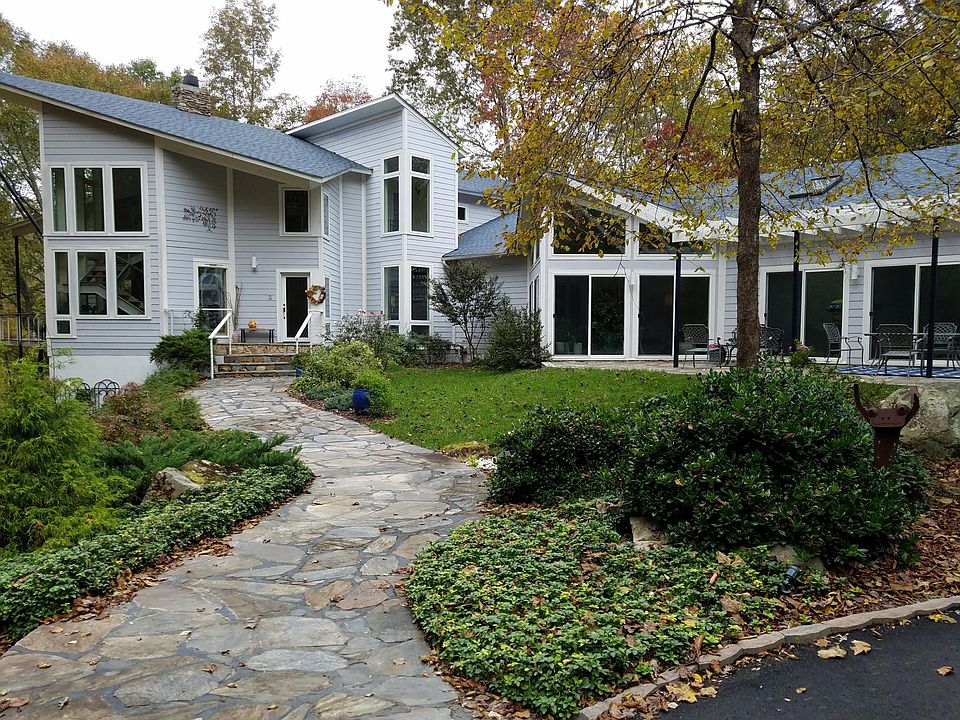 Driveway entrance to house; lower, ground level for rent