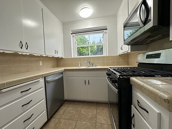 Spacious Kitchen - Includes Dishwasher, stove, microwave and refrigerator