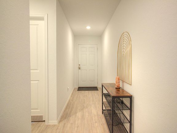 Hallway, access to bedroom 1 and bathroom 1 on left.