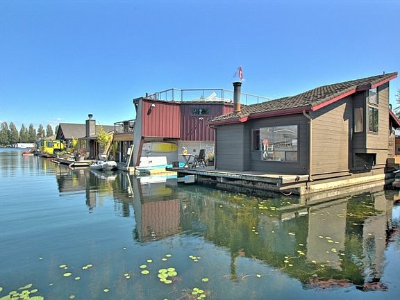 Peaceful waterfront in Portage Bay w/large boat moorage, parking & storage.