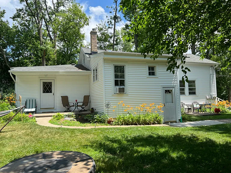Rear entry. 
15' x 10' covered porch.
West facing.