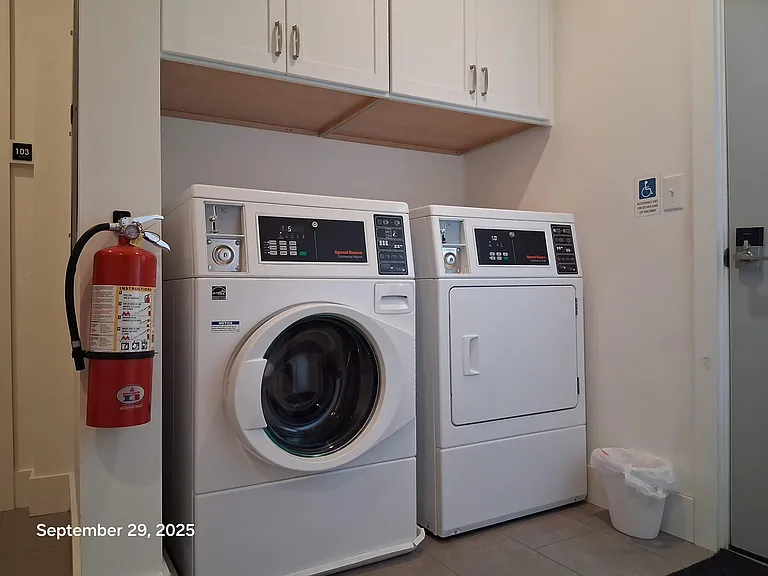 1st floor laundry center with coin operated Speed Queen W/D