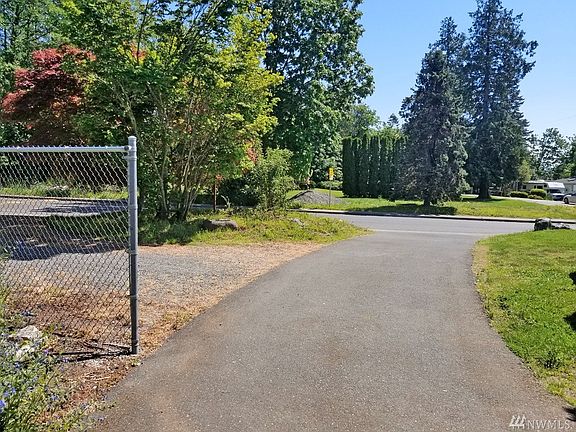Entry to the property from the side road Eagle Ave.  6/10 of an acre on the other side of this road is part of the subject property