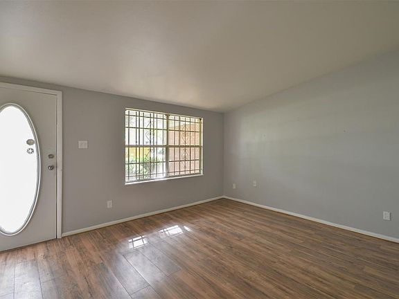 Beautiful flooring and fresh paint brightens the large family room.