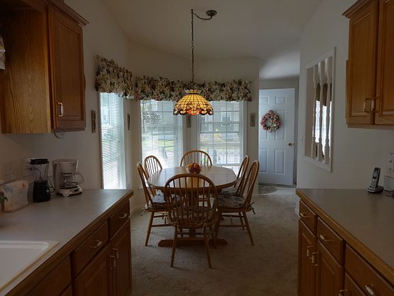 The kitchen table is locate...