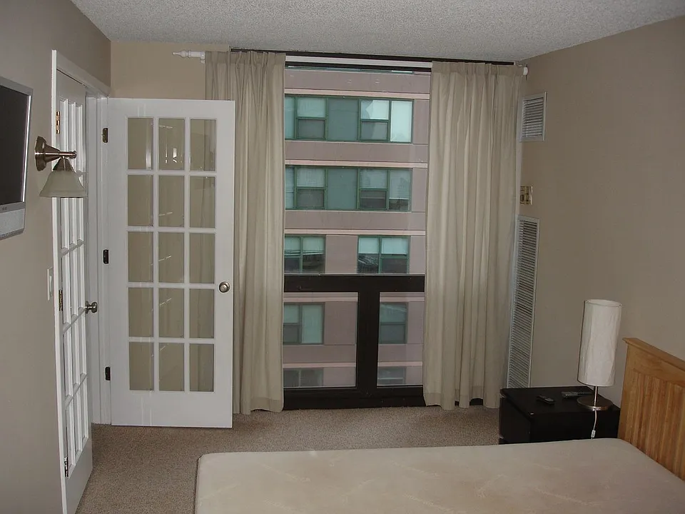 Bedroom is large (9' x 18') and includes a closet / built-in TV