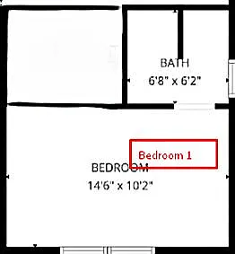 Spacious bedroom with a practical layout offering room for a bed set and additional furnishings, plus nearby bath access.